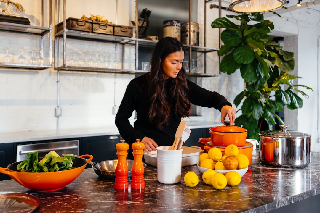 woman-standing-in-front-of-fruits-holding-pots-lid-ktrov7eujms